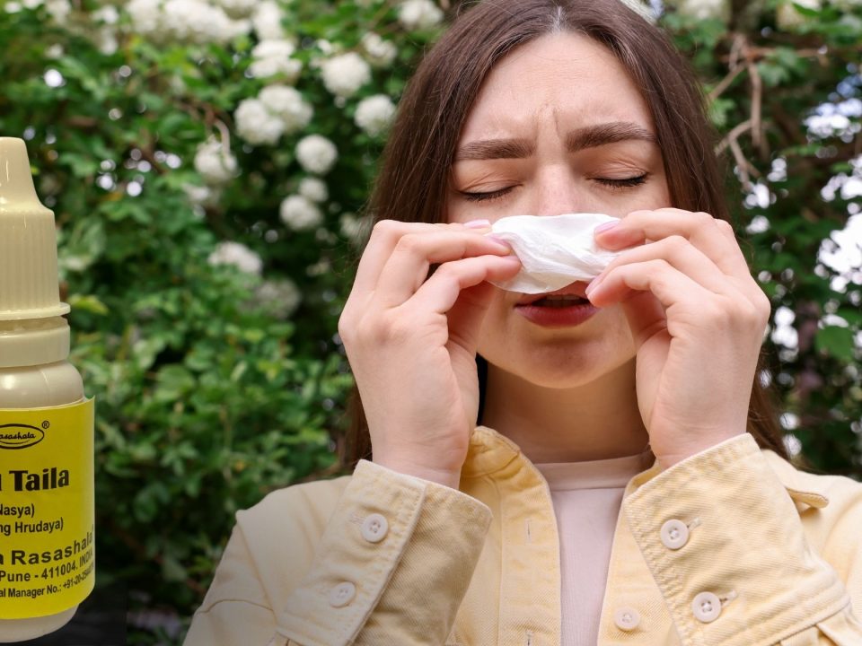 a woman with blocked nose and bottle of anu taila